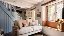 The sitting-room is just right for four guests and packed with original features and charm. Imagine a morning coffee with a book sat in the window seat...