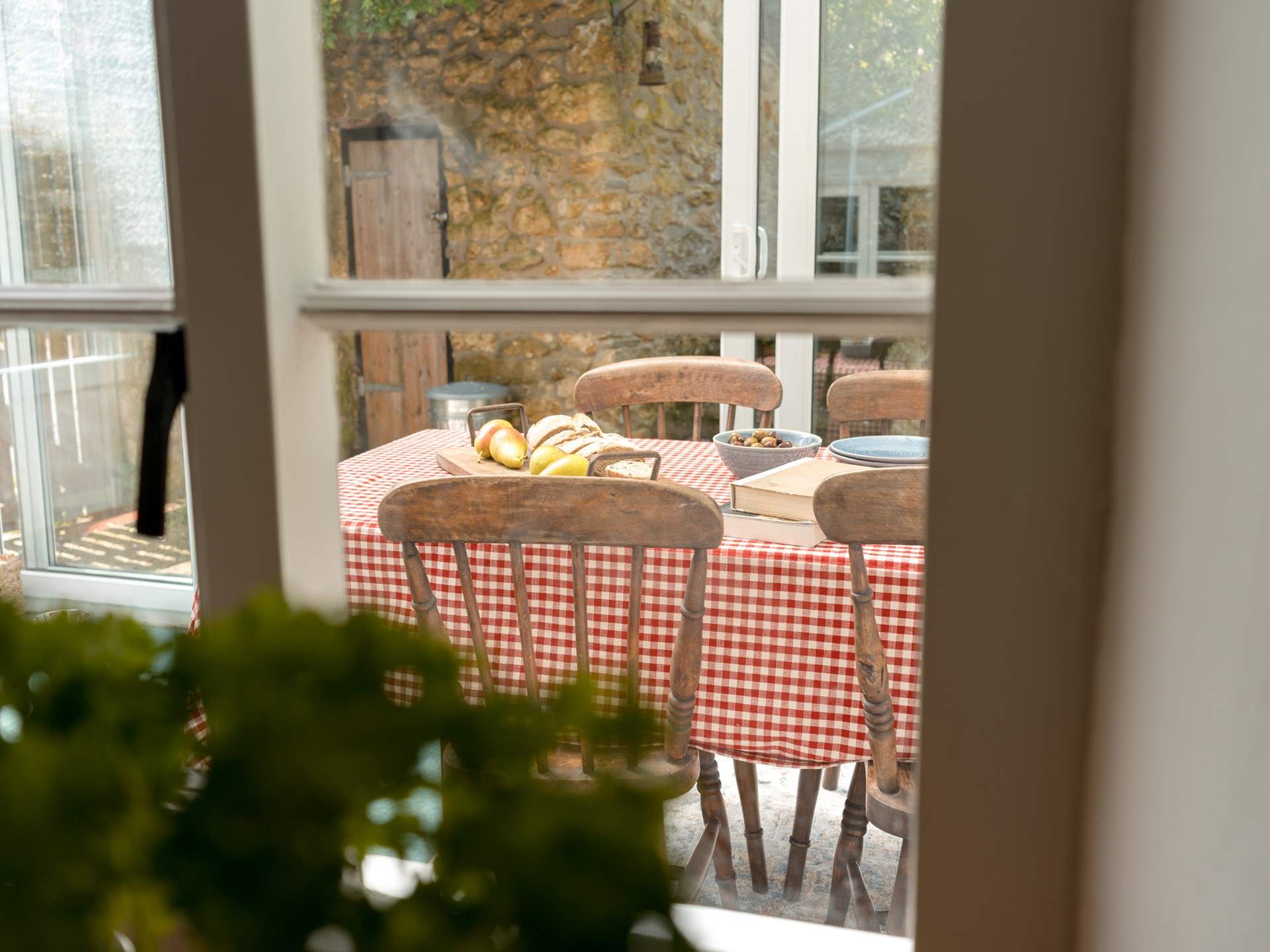A glimpse through from the kitchen to the lovely sun-room and dining space.
