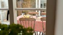 A glimpse through from the kitchen to the lovely sun-room and dining space.
