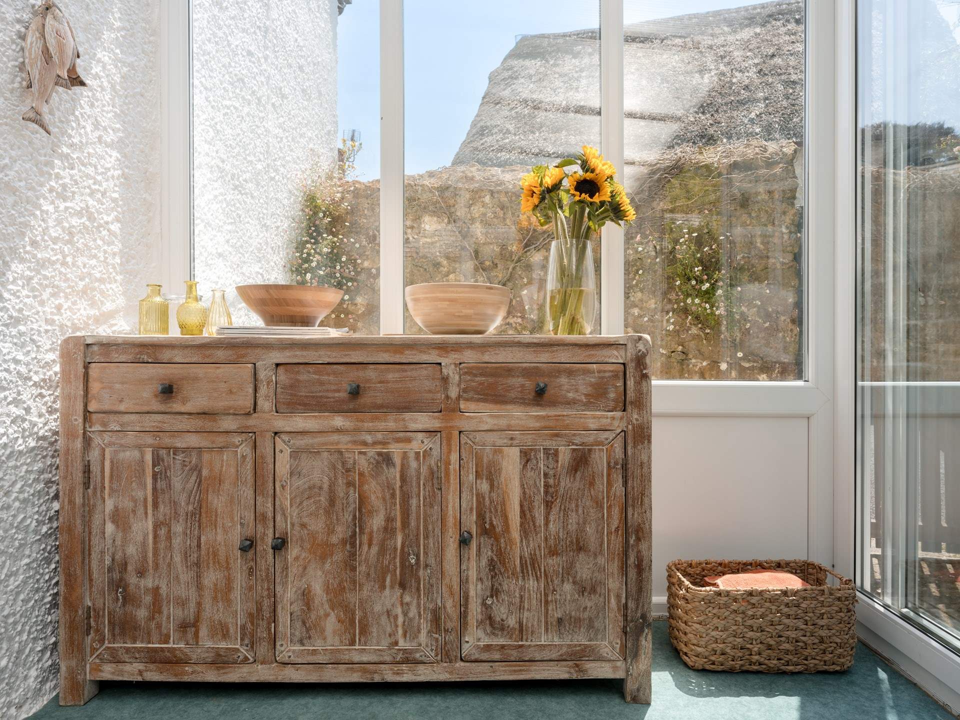 The use of sympathetic natural materials is on evidence throughout... Note that you will find all your crockery, cutlery and glassware in this sideboard.
