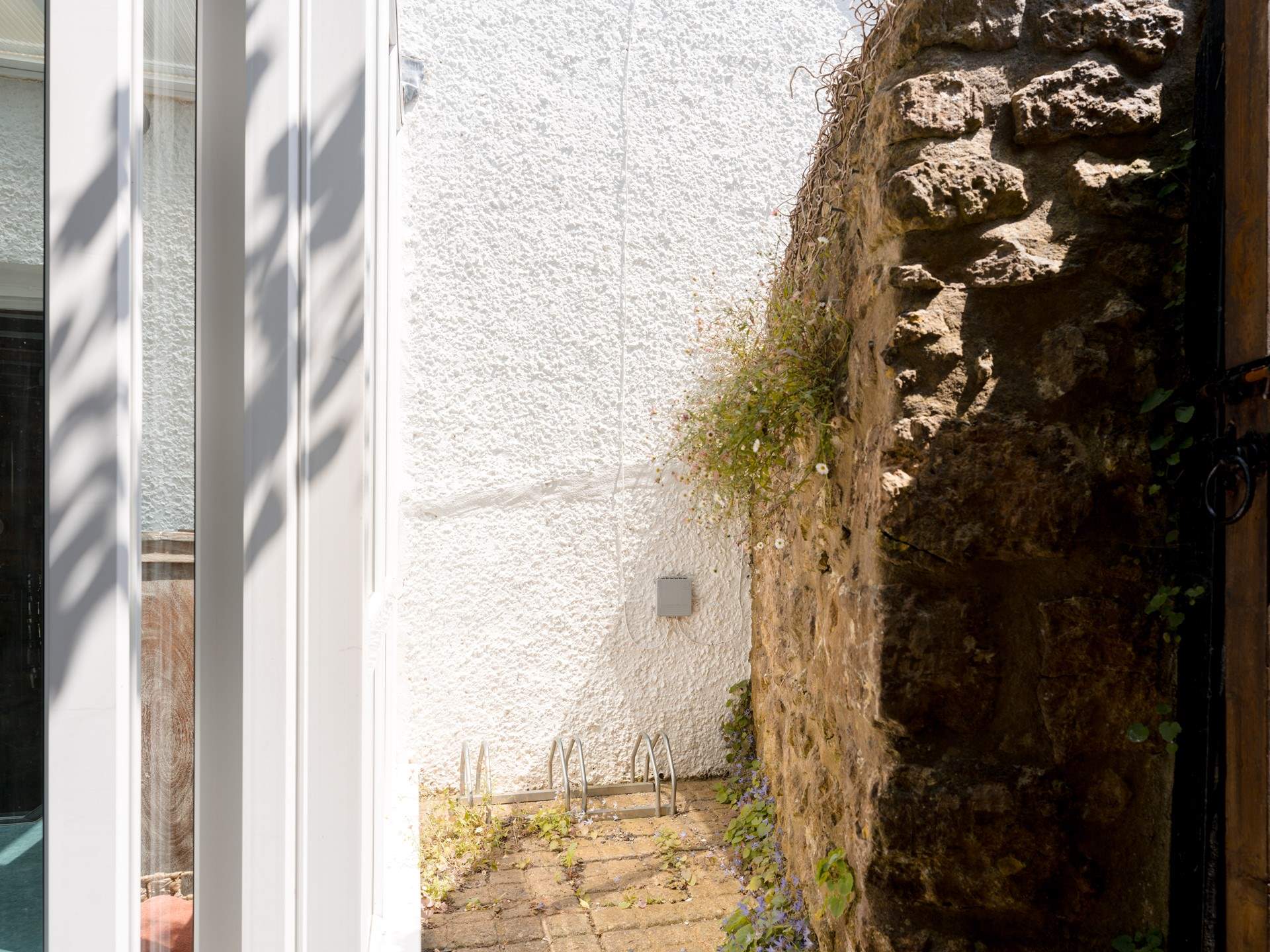 A few spots for your bikes are tucked behind the sun-room and there is a separate access gate to the garden for ease.