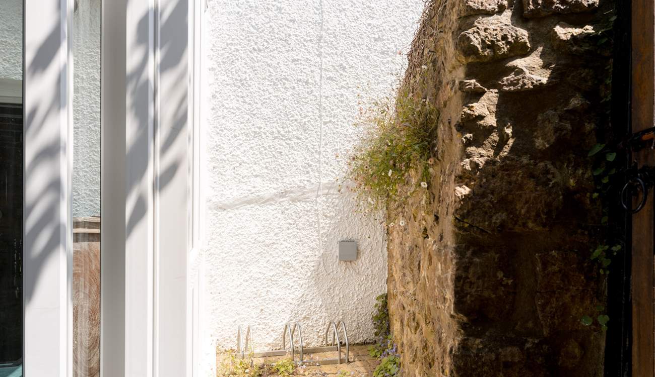 A few spots for your bikes are tucked behind the sun-room and there is a separate access gate to the garden for ease.