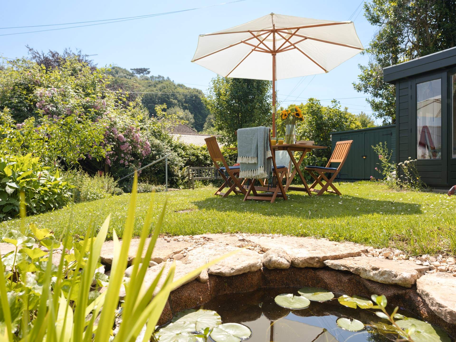 The elevated garden allows for some lovely views over the thatched roof tops of the village. Just note there is a small uncovered pond.
