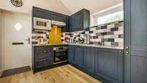 Cook up a sumptuous meal in this well-equipped kitchen.