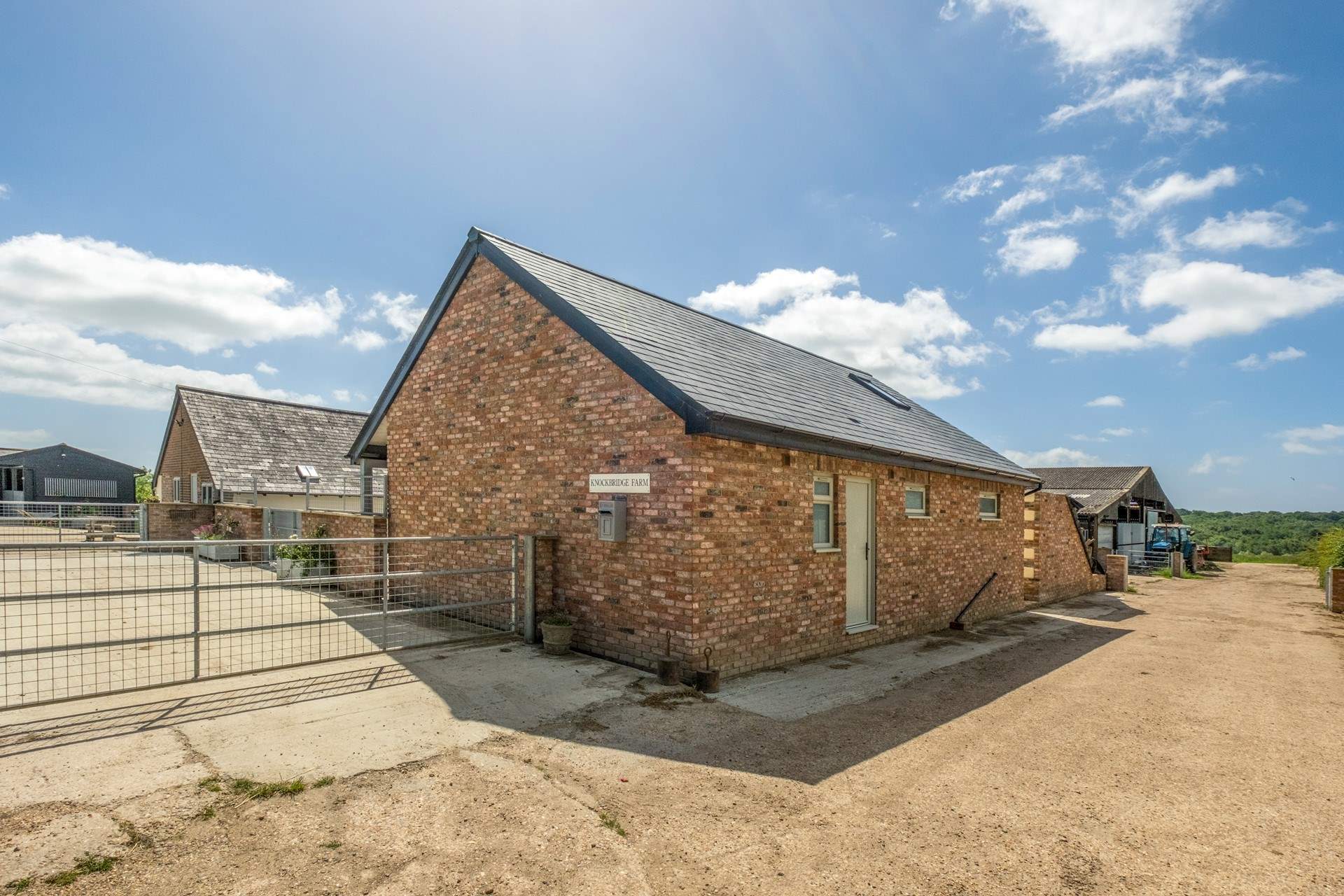 The Old Tractor Shed is on a traditional working farm with sheep and horses..