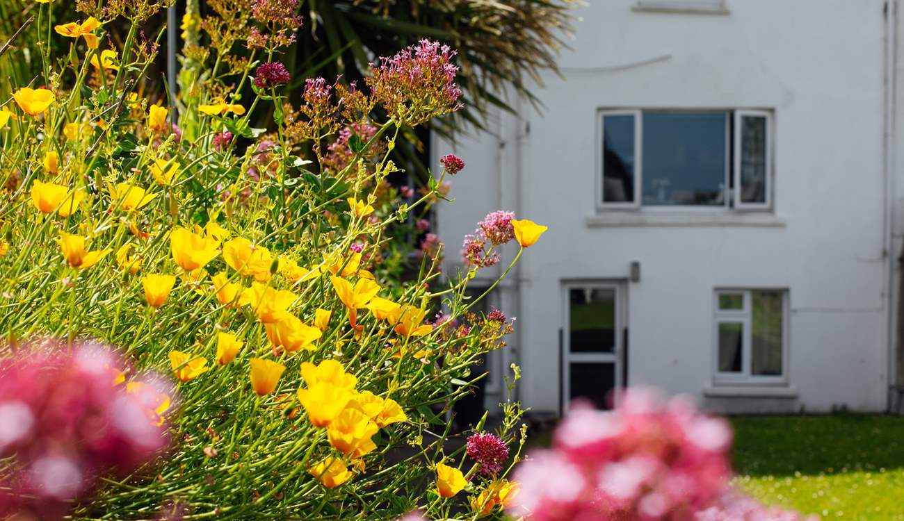 Children and dogs will love playing on the private, lawned enclosed garden. (Remember to close the beach gate).
