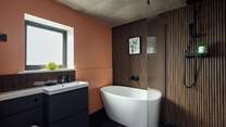 Enjoy a blissful soak in the deep bath after a day exploring the Pembrokeshire Coast Path. 