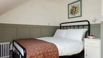 Simple elegance with quality Welsh throw in the second double room in Canol. 