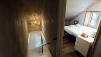 Climb the stairs to both bedrooms in Nol.