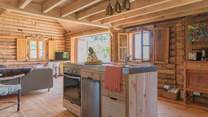 The free-standing kitchen has an oven, hob and fridge with ice-box.