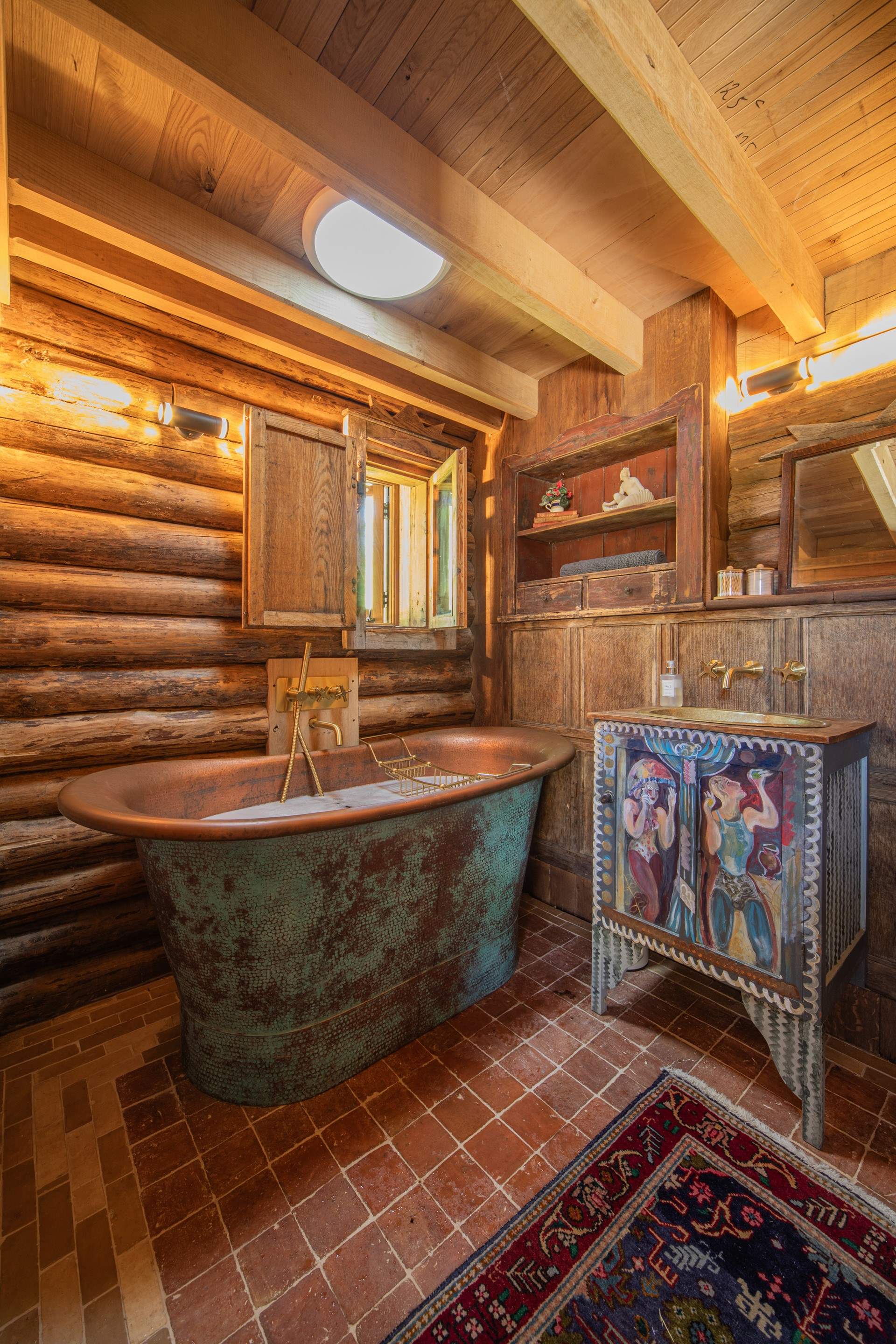 Long soaks in this gorgeous copper bath tub.