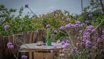 Al fresco dining in the pretty cottage garden.