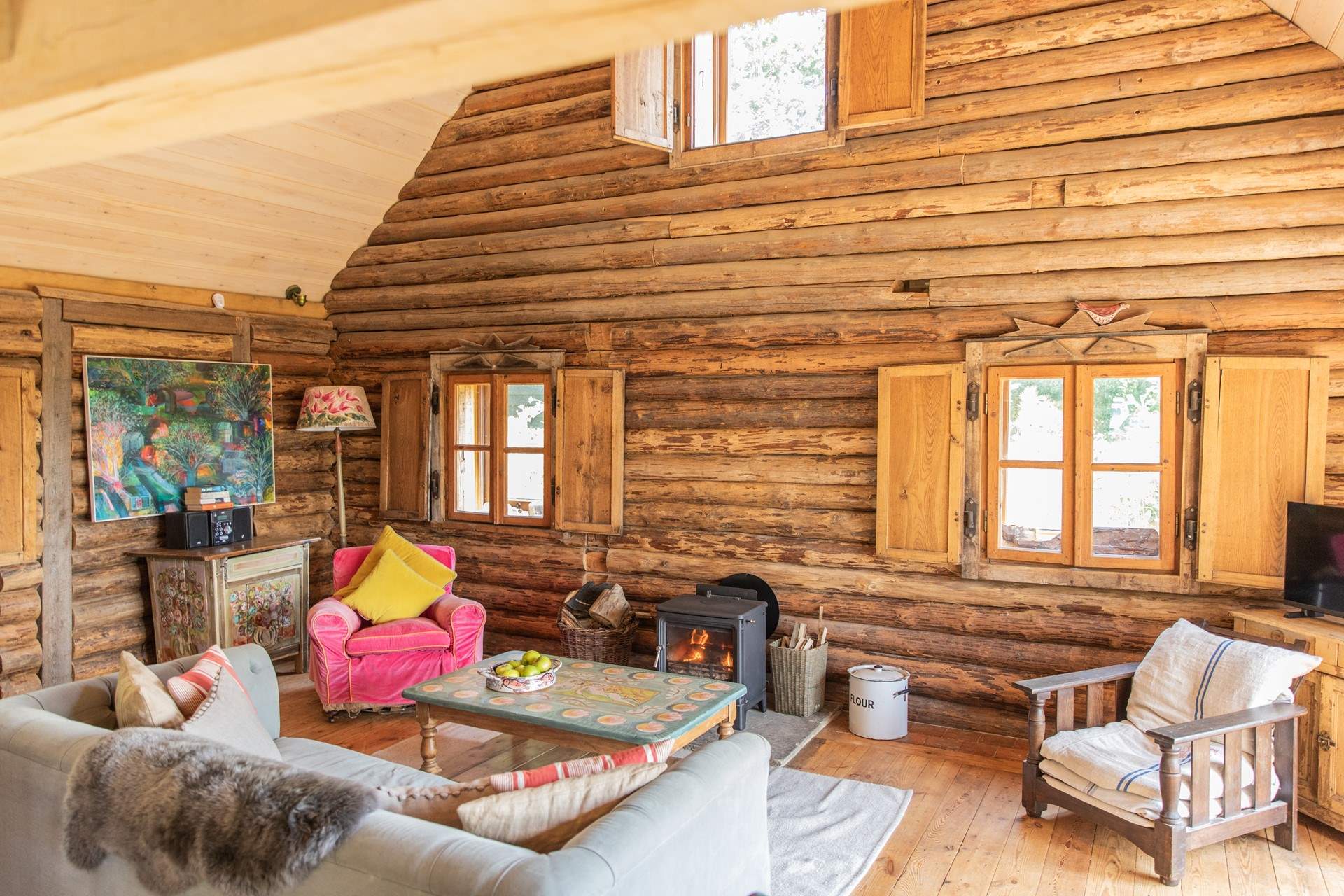 During the cooler months snuggle up in front of the roaring wood-burning stove.