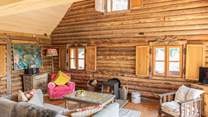 During the cooler months snuggle up in front of the roaring wood-burning stove.