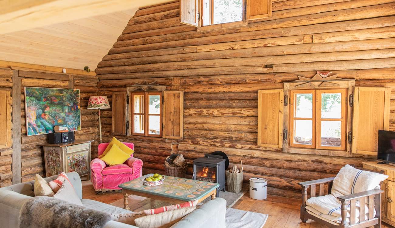 During the cooler months snuggle up in front of the roaring wood-burning stove.