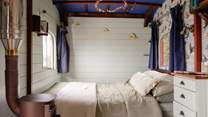 A dreamy double bed promises a restful night's sleep.
