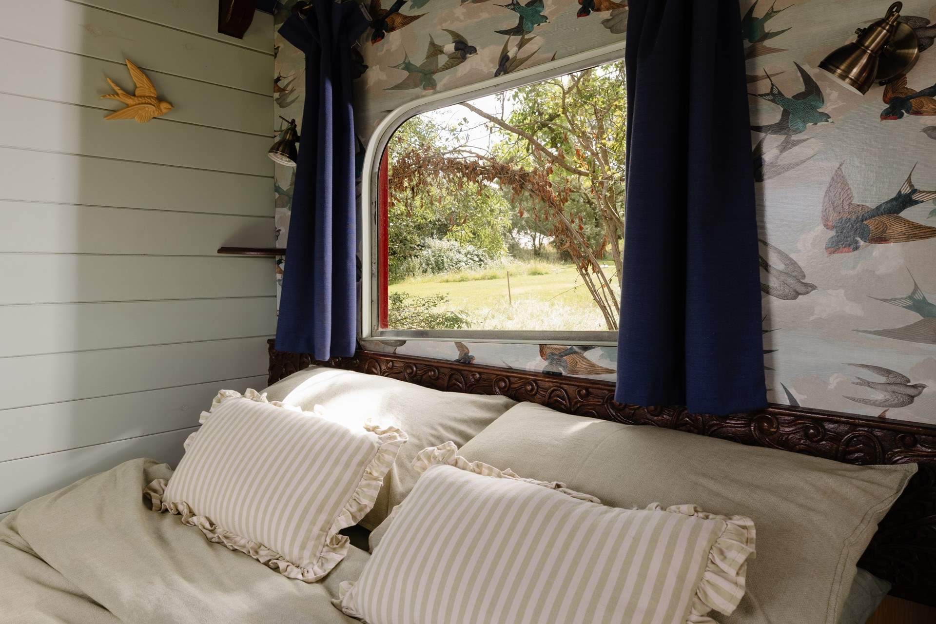 Draw back the curtains and let the early morning light filter through the trees. 