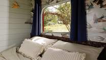 Draw back the curtains and let the early morning light filter through the trees. 