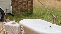 Sink into the wood-fired roll-top bath in your very own oasis of calm. 