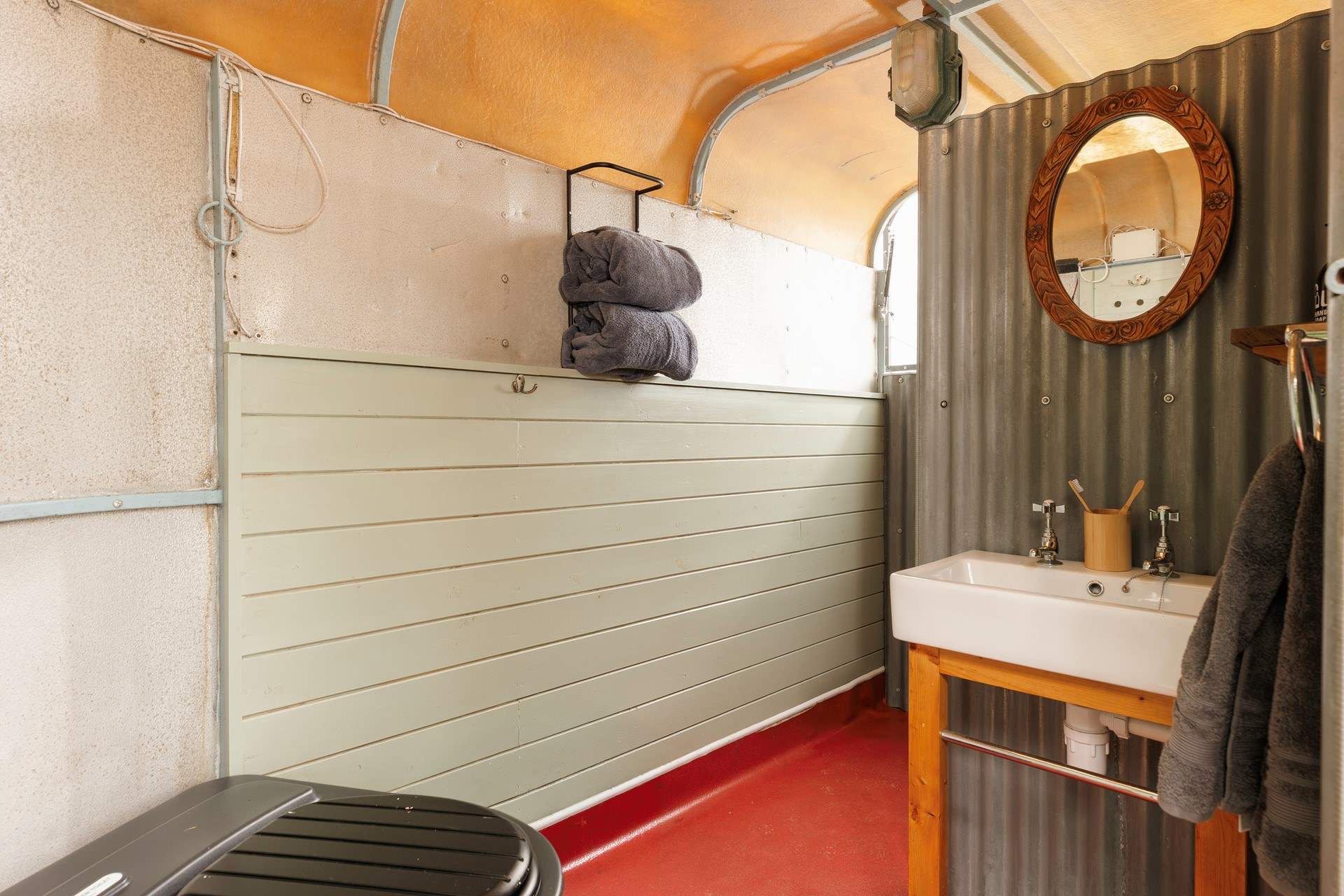 Outside, a horse trailer has been transformed into a light-filled bathroom just footsteps from your hideaway.