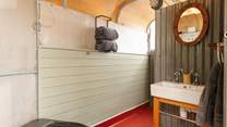 Outside, a horse trailer has been transformed into a light-filled bathroom just footsteps from your hideaway.
