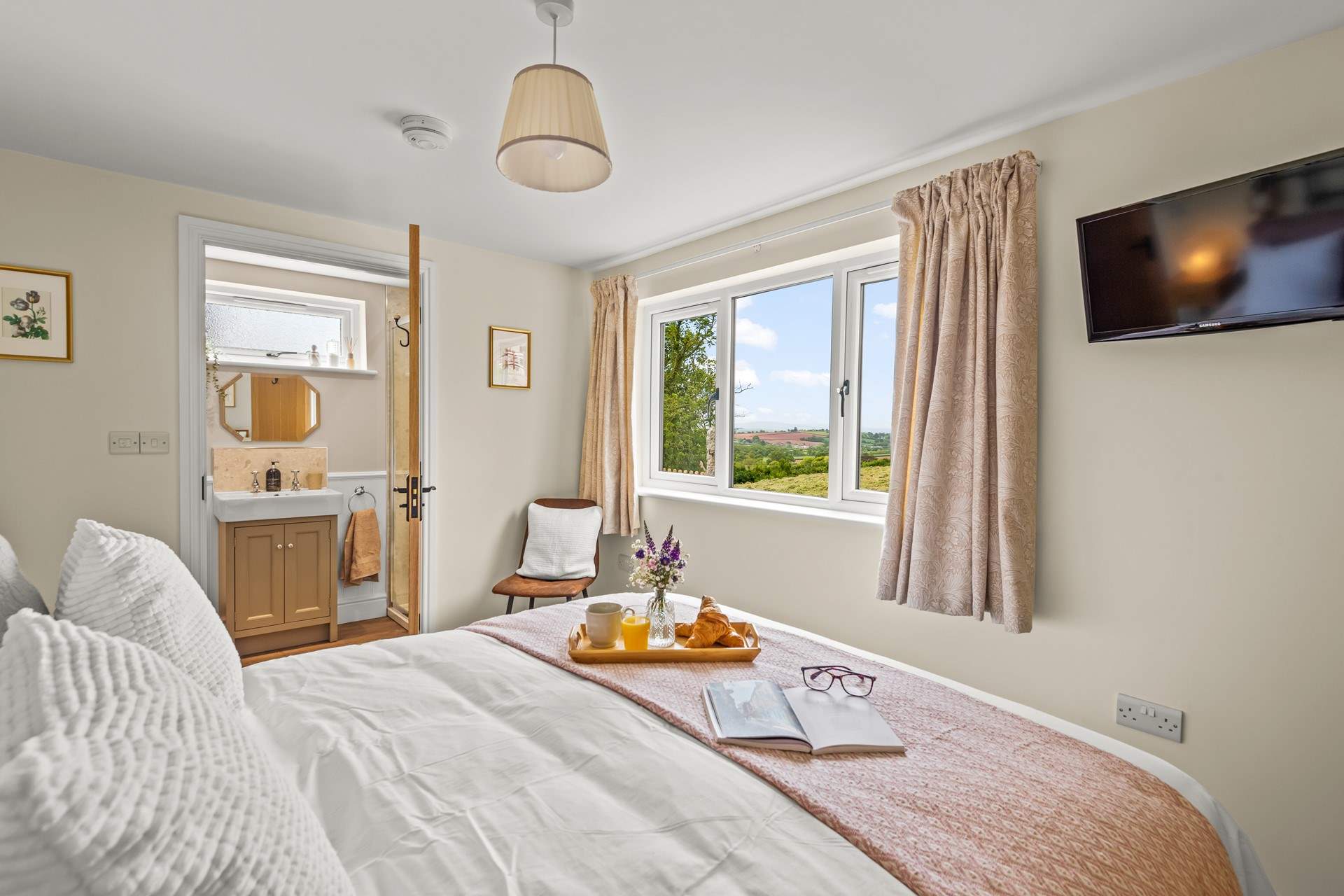 Bedroom 1 has a king-size bed with countryside views and a fabulous en suite shower-room.