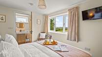 Bedroom 1 has a king-size bed with countryside views and a fabulous en suite shower-room.