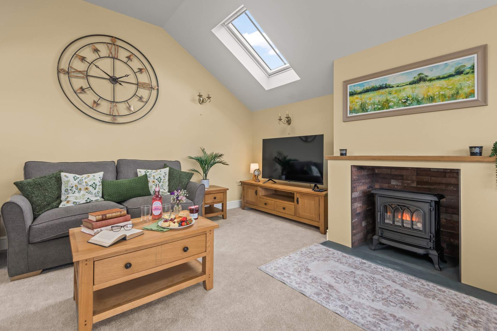 Snuggle up in front of the wood-burner effect electric stove on those chillier evenings.