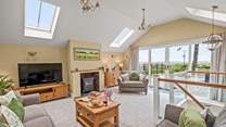 The sitting-room can be found on the first floor making the most of those fabulous views.