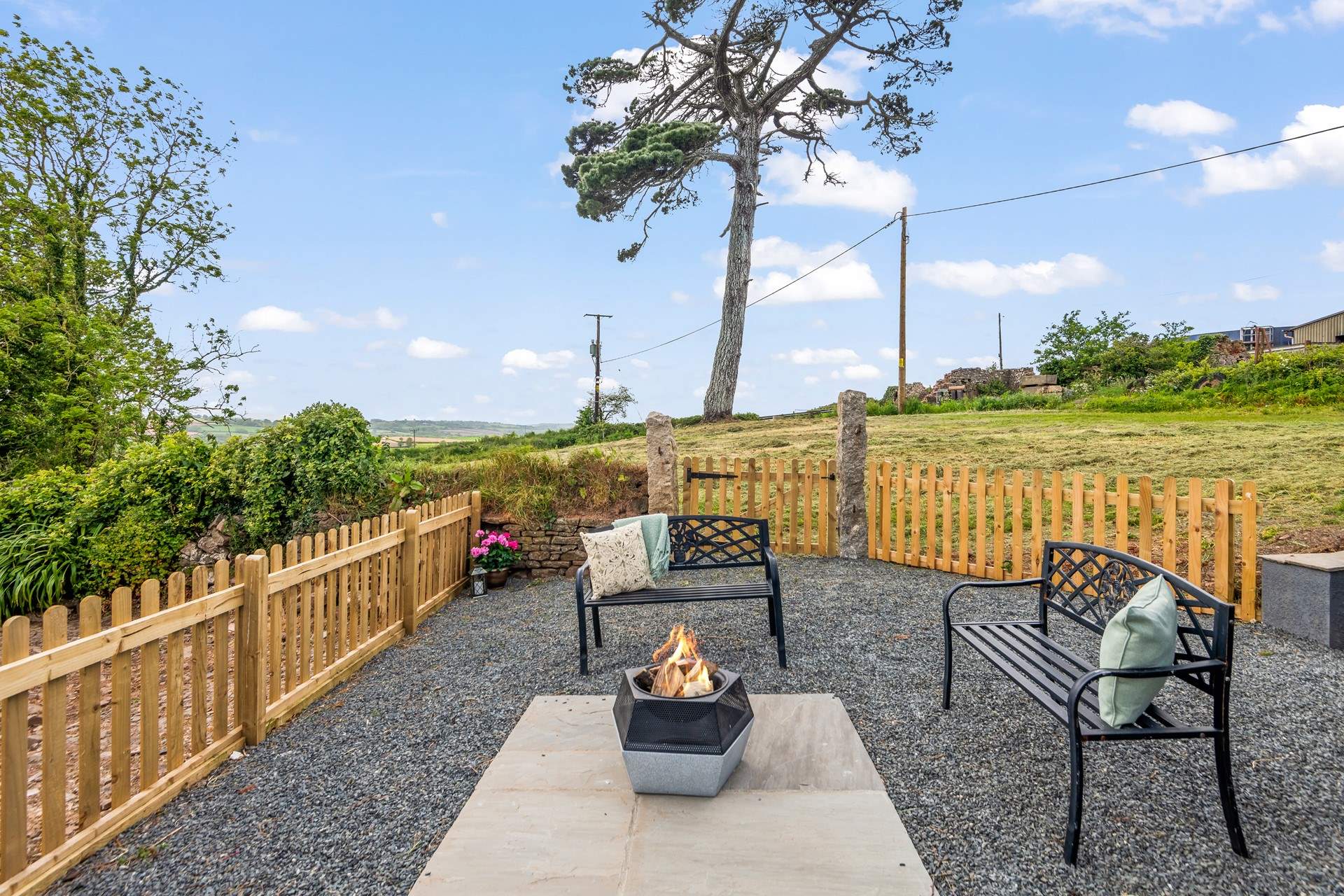 Another fabulous seating-area equipped with a fire-pit/barbecue.