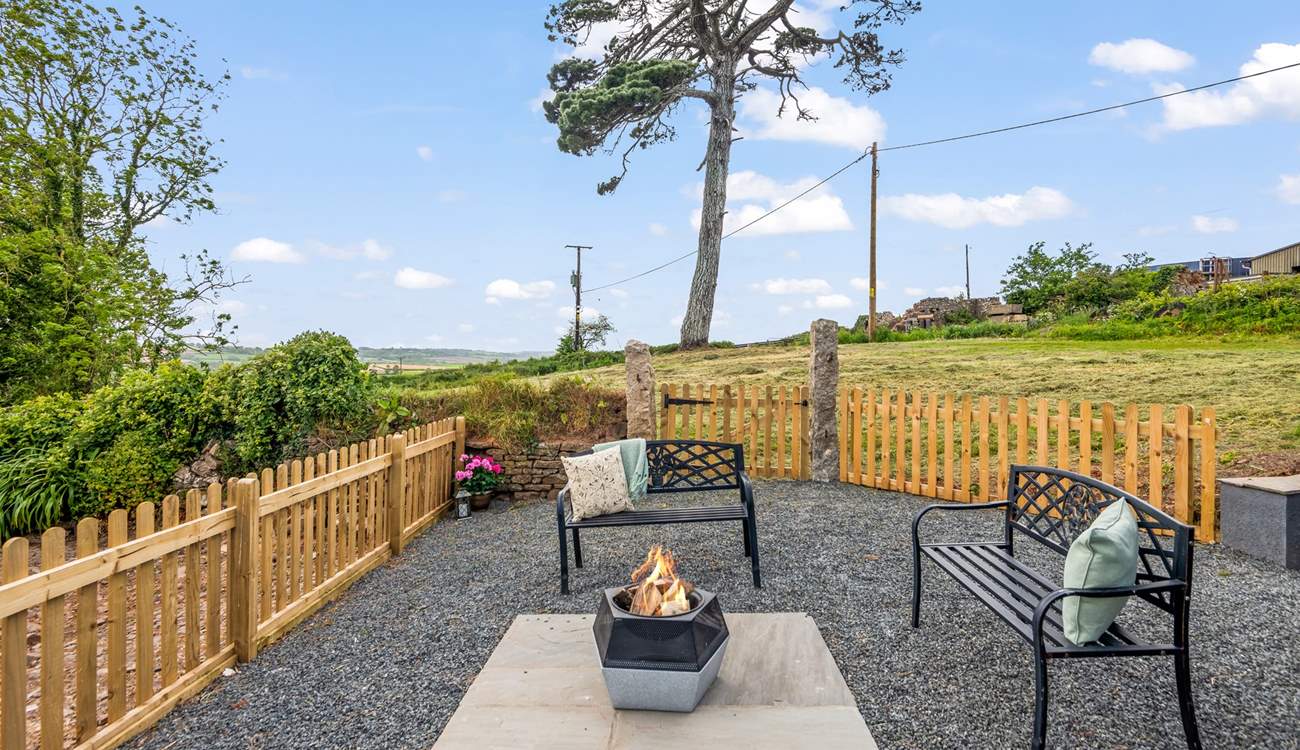Another fabulous seating-area equipped with a fire-pit/barbecue.
