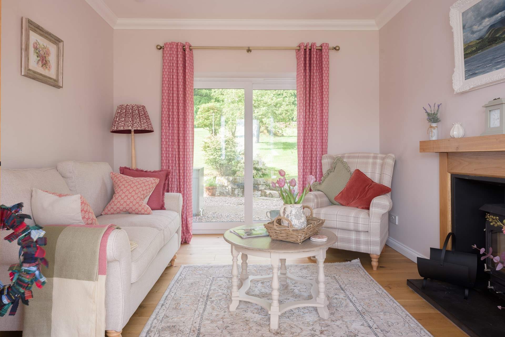 The sitting-room has doors to the large garden. 