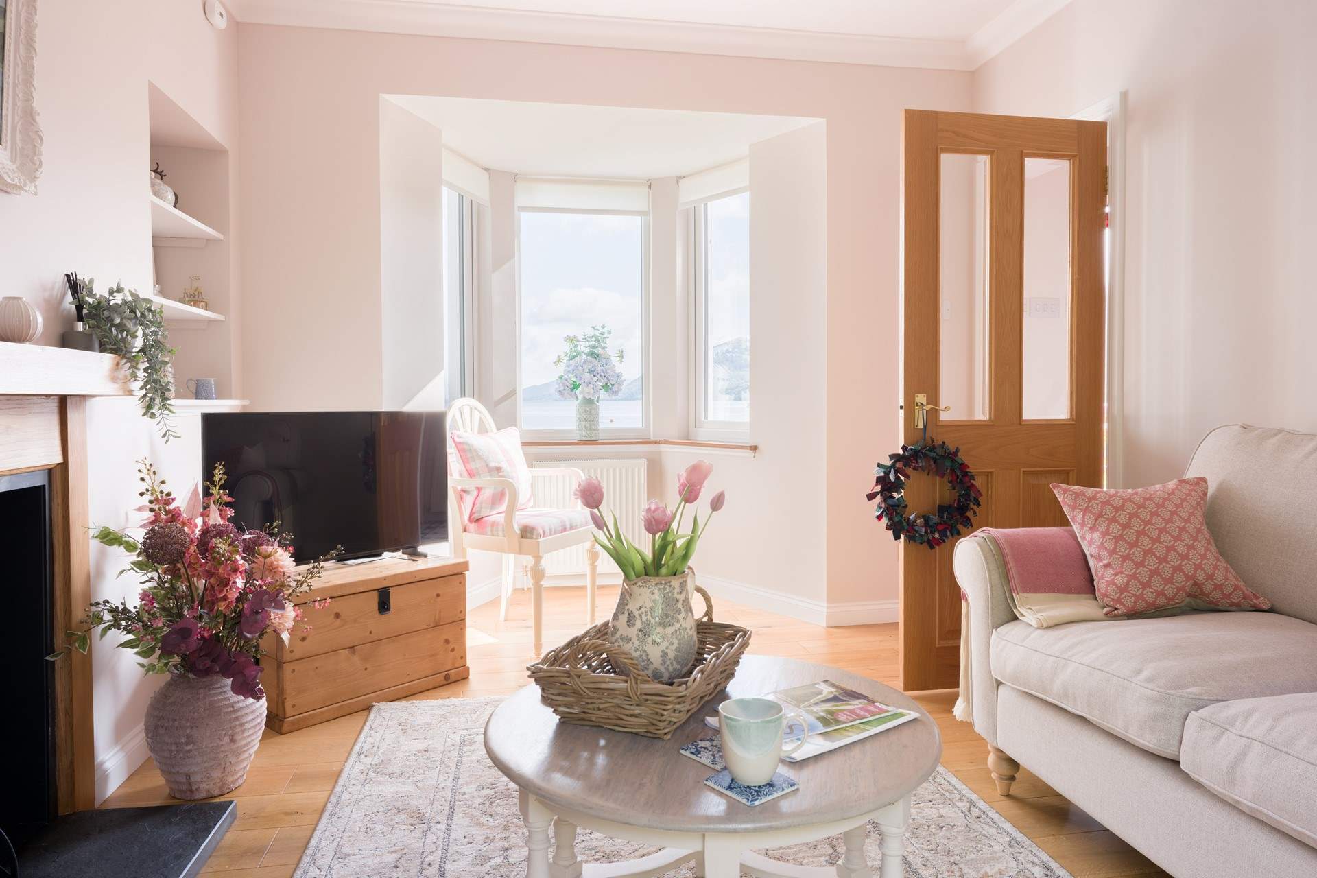 The sitting-room has long-range views of the loch.