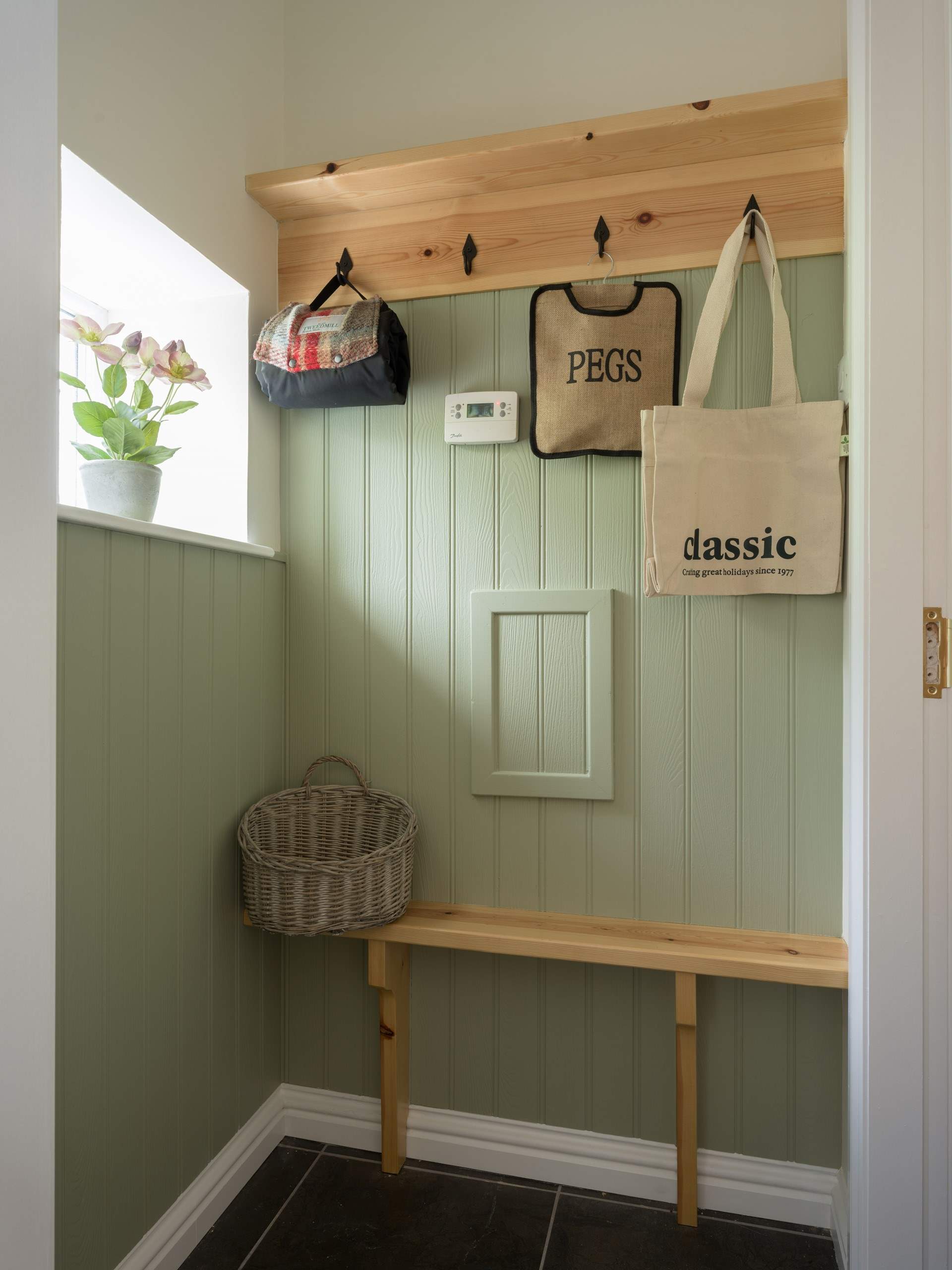 The boot-room has plenty of storage for boots and coats.