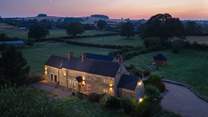 In the evening the house lights up.