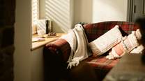 This cosy corner makes a perfect quiet reading nook.