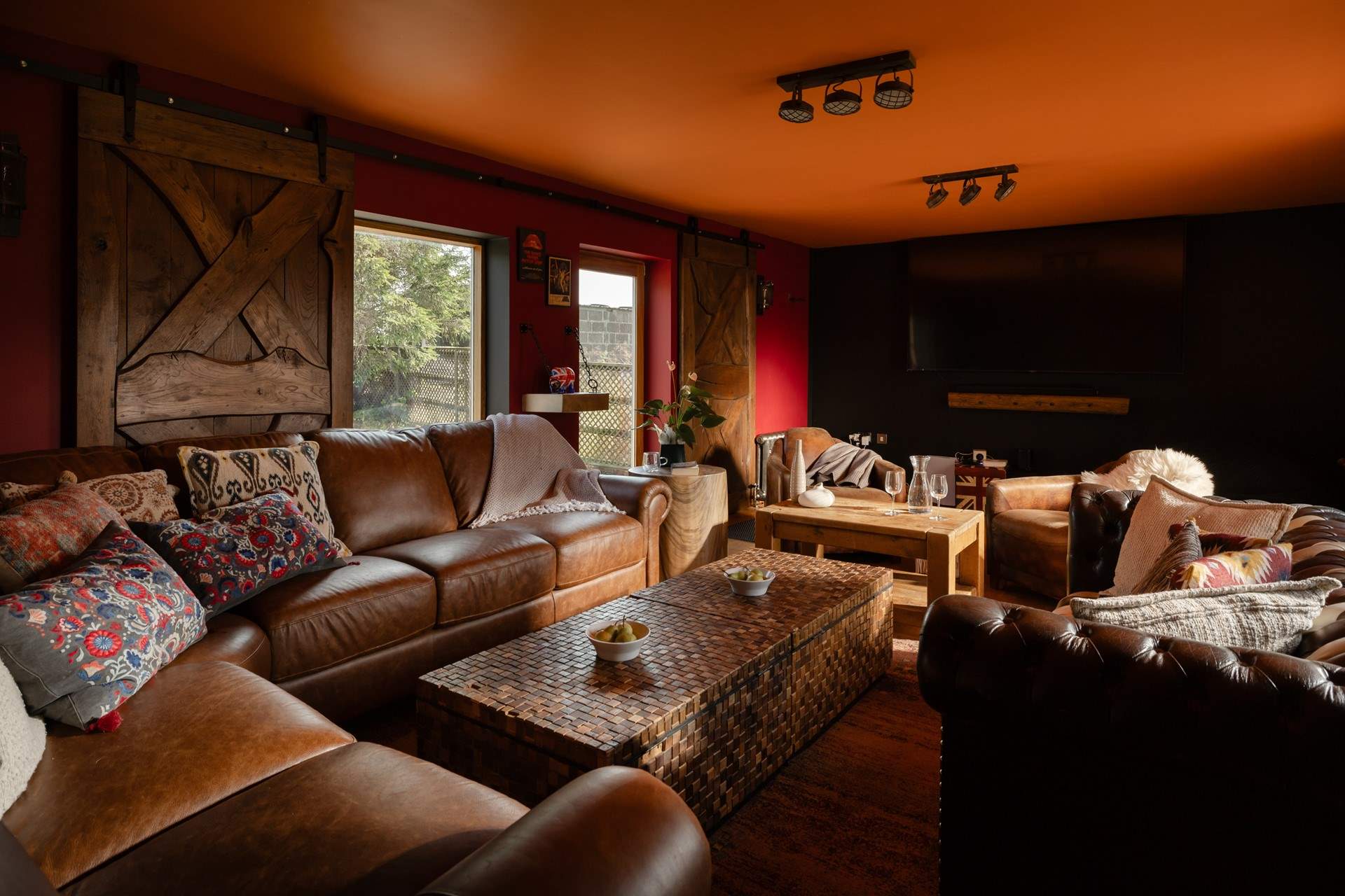 The cosy sitting-room doubles up as a cinema-room when the doors slide over the windows.