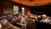 The cosy sitting-room doubles up as a cinema-room when the doors slide over the windows.