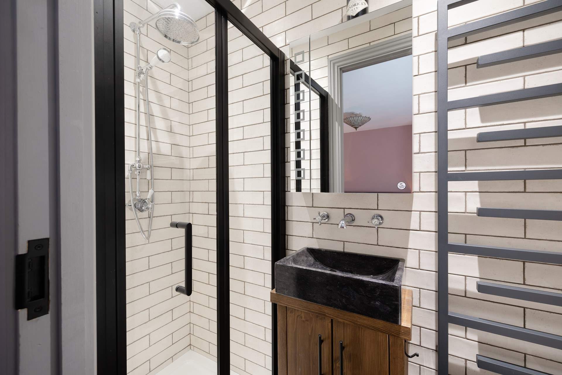 The quirky en suite has a rain-head shower.