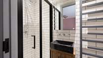 The quirky en suite has a rain-head shower.