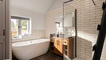 Sink into this bath and watch the wildlife through the window.