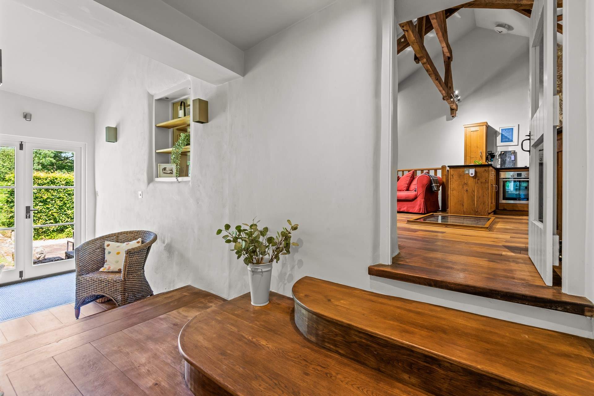 Step down from the living area into the newly created part of the property.