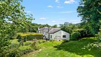 The garden backs onto the grounds of Bovey Castle. This row of cottages enjoy an historic relationship with Bovey Castle.