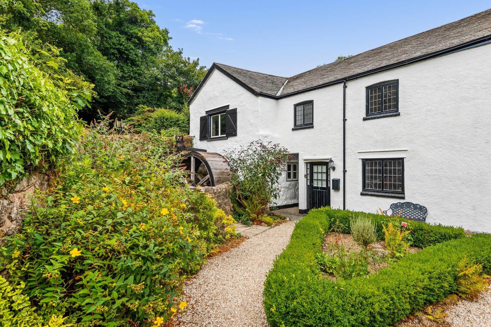 Once through the gate, make your way down the path to New Mill, proudly awaiting your arrival.
