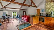 Heading upstairs, you are welcomed into this spacious living area. The focal point being the hatch which is preserved and showcased within the floor space, please mind your step as the casing is raised.