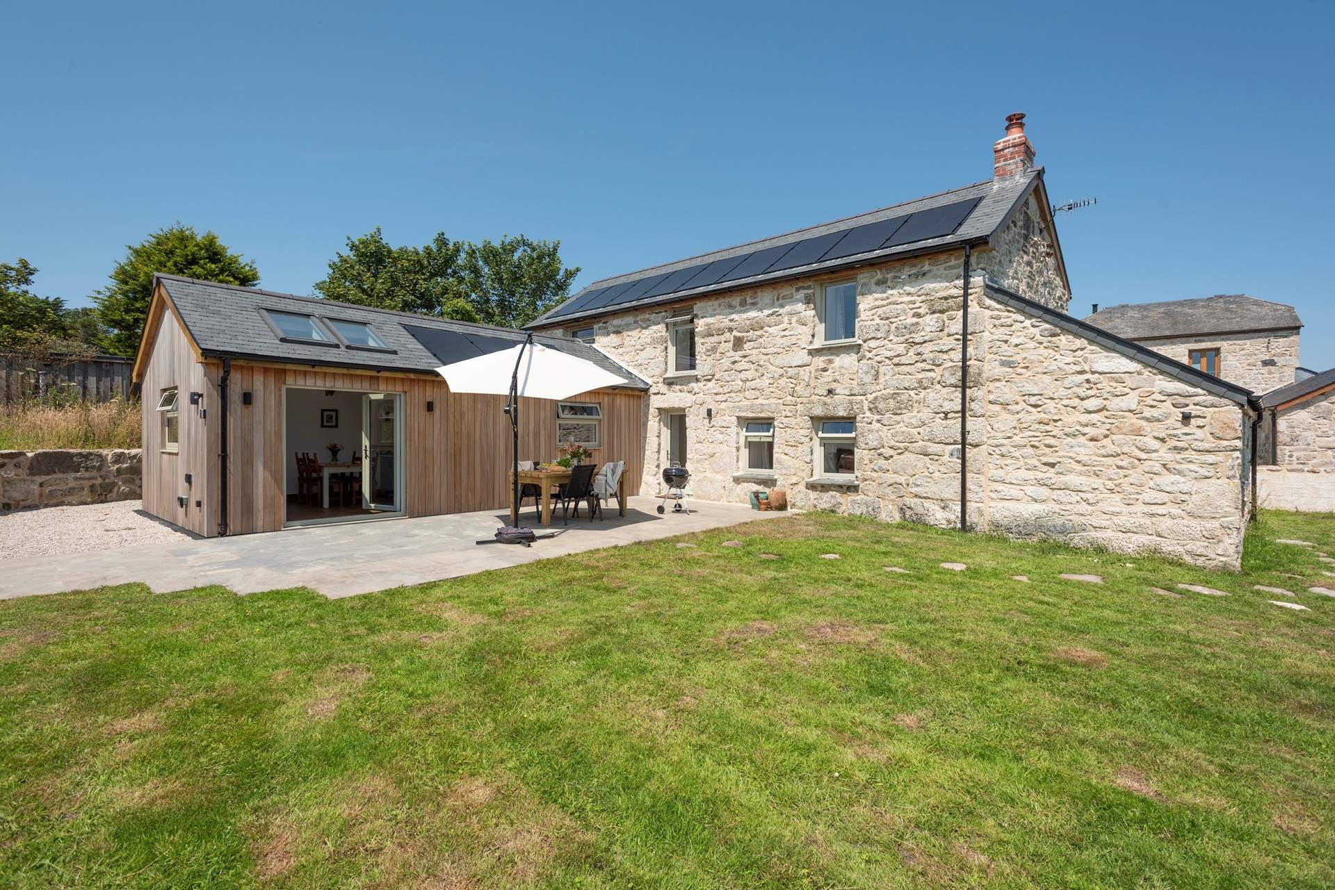 An eco-conscious home with air source heat pump and solar panels.