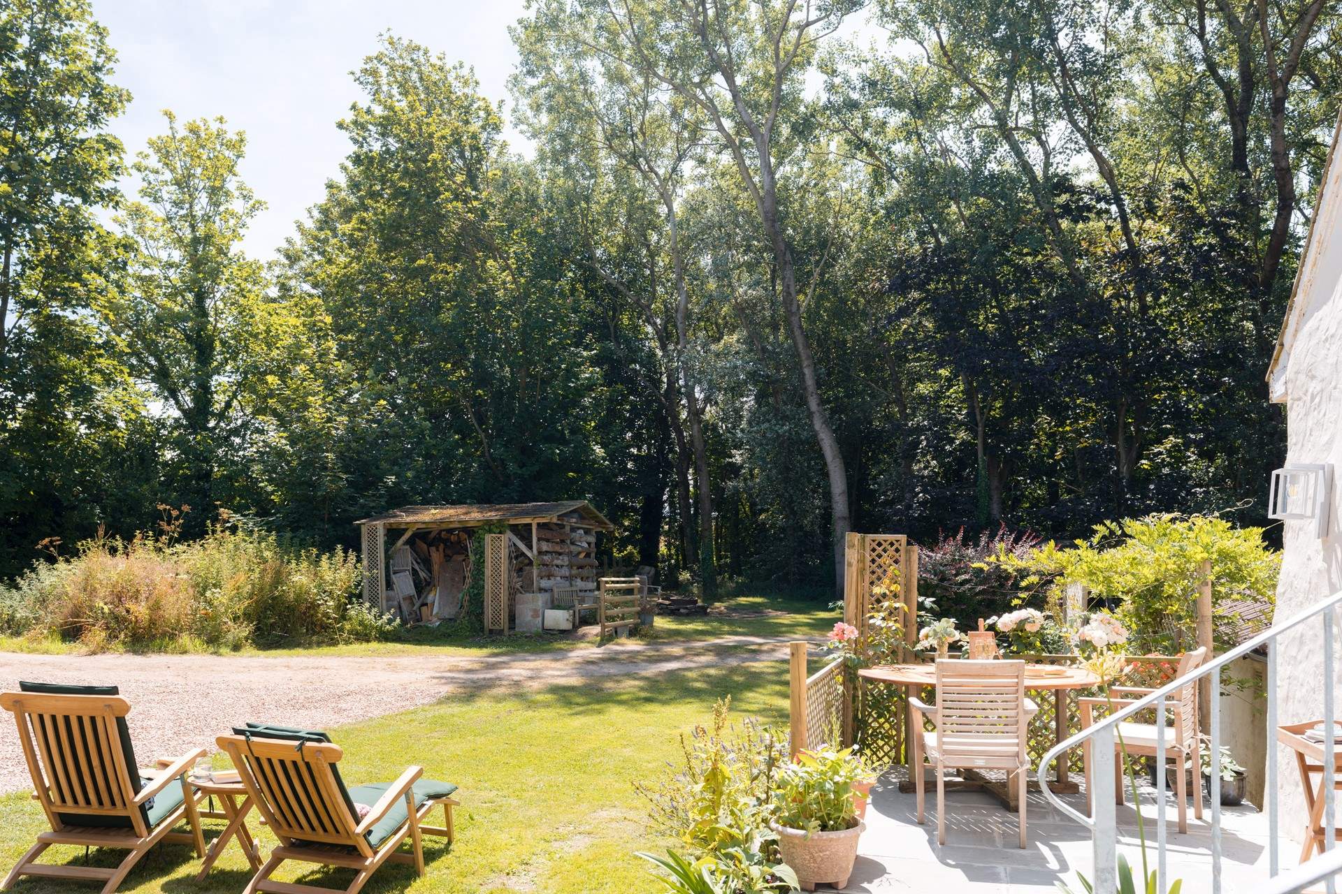 The garden area and patio are not enclosed and the driveway is shared with the owners.