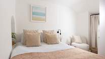 The cosy king-size bed. 