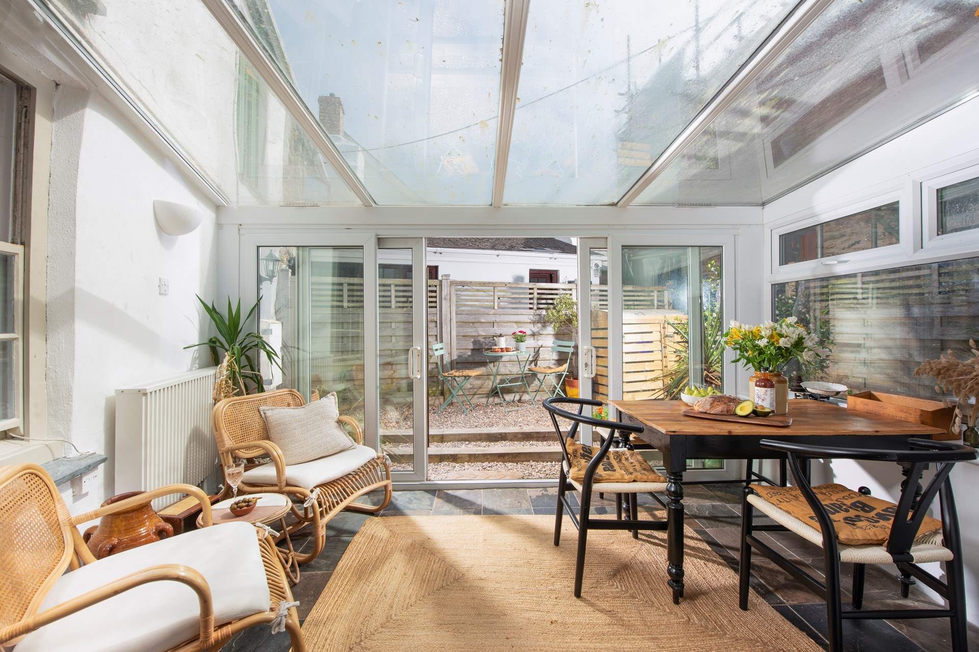The bright and sunny dining-area overlooks the courtyard garden. 