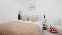 The relaxing bedroom has a king-size bed. 